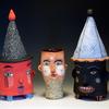Two lidded jars and a face cup